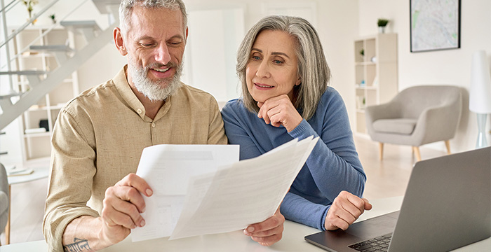 Photo of a couple reviewing documents